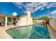 Relaxing pool with outdoor seating, a barbecue grill, and a view of the backyard at 4381 N 86Th St, Scottsdale, AZ 85251