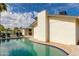 Stunning pool area with a view of the home's architecture and outdoor seating area at 4381 N 86Th St, Scottsdale, AZ 85251