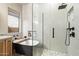 Modern bathroom featuring a glass-enclosed shower, soaking tub, and stylish white tile work at 4411 E Spur Dr, Cave Creek, AZ 85331