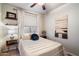 Cozy bedroom featuring a ceiling fan, natural light, and modern interior design at 4411 E Spur Dr, Cave Creek, AZ 85331