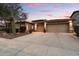 Inviting home featuring a spacious three-car garage and desert landscaping for low-maintenance appeal at 4411 E Spur Dr, Cave Creek, AZ 85331