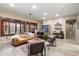 Inviting living room with a comfortable leather sofa, stylish decor, and wood-look tile flooring at 4411 E Spur Dr, Cave Creek, AZ 85331