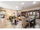 Open-concept living room featuring wood-look tile, with a dining area and comfortable seating arrangement at 4411 E Spur Dr, Cave Creek, AZ 85331