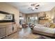 Bright main bedroom featuring wood-look tile flooring and views of the backyard at 4411 E Spur Dr, Cave Creek, AZ 85331