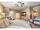 Comfortable main bedroom with neutral tones, a king-size bed, and access to the en-suite bathroom at 4411 E Spur Dr, Cave Creek, AZ 85331