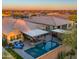 Aerial shot showcasing the backyard pool, covered patio, and beautifully landscaped property at 4462 S Frequency Dr, Mesa, AZ 85212