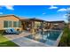 Stunning pool with integrated spa, covered lounge area, and outdoor entertainment space at 4462 S Frequency Dr, Mesa, AZ 85212