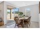 Charming dining room with wood table and chairs, sliding door to covered patio at 4595 W Stonecrop Dr, San Tan Valley, AZ 85144