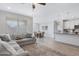 Open concept living room with dining area and modern kitchen with granite counters at 4595 W Stonecrop Dr, San Tan Valley, AZ 85144