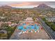 Aerial view of a large custom home under construction, featuring a mountain backdrop at 6001 N 37Th Pl, Paradise Valley, AZ 85253