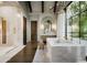 Bright bathroom with marble floors, soaking tub, walk-in shower, and stylish vanity at 6001 N 37Th Pl, Paradise Valley, AZ 85253