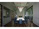 Elegant dining room with grand lighting, fireplace, and ample natural light at 6001 N 37Th Pl, Paradise Valley, AZ 85253