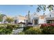 Charming white home with beautiful landscaping, fountain, and well-manicured flower beds at 6001 N 37Th Pl, Paradise Valley, AZ 85253