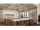 Modern kitchen boasts pendant lighting, marble countertops, and a large island with bar seating at 6001 N 37Th Pl, Paradise Valley, AZ 85253