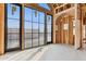 Unfinished living room boasting dark window frames that enhance natural light, framed arched doorway, and concrete floor at 6001 N 37Th Pl, Paradise Valley, AZ 85253