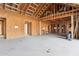 Unfinished living room exhibiting raw framing, plywood walls, and exposed ceiling beams, offering a glimpse into construction at 6001 N 37Th Pl, Paradise Valley, AZ 85253