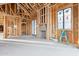 Unfinished living room with wood framing, natural light, and a ladder, highlighting its ongoing development at 6001 N 37Th Pl, Paradise Valley, AZ 85253