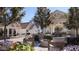 Relaxing patio area with comfortable seating surrounding a cozy outdoor fireplace at 6001 N 37Th Pl, Paradise Valley, AZ 85253