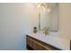 Elegant powder room featuring a modern vanity, stylish mirror, and decorative lighting at 7047 E Earll Dr # 1002, Scottsdale, AZ 85251