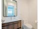 Modern bathroom with sleek vanity, stylish mirror, toilet, and contemporary fixtures at 7047 E Earll Dr # 1002, Scottsdale, AZ 85251