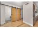 Bathroom featuring wood sliding doors, a decorative floor tile design, and stainless steel appliances at 7047 E Earll Dr # 1002, Scottsdale, AZ 85251