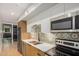 Well-lit kitchen featuring stainless steel appliances, ample counter space and cabinets at 7047 E Earll Dr # 1002, Scottsdale, AZ 85251