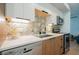 Stylish kitchen featuring white countertops, stainless steel appliances, and a decorative backsplash at 7047 E Earll Dr # 1002, Scottsdale, AZ 85251