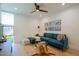 Living Room featuring a modern sectional sofa, a decorative rug, hardwood floors, and designer lighting at 7047 E Earll Dr # 1002, Scottsdale, AZ 85251