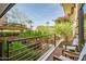 Cozy balcony with comfortable seating and a view of lush greenery and landscaping at 7121 E Rancho Vista Dr # 2002, Scottsdale, AZ 85251