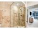 Tiled shower with glass door and chrome fixtures, adding a touch of elegance at 7121 E Rancho Vista Dr # 2002, Scottsdale, AZ 85251