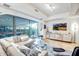 Modern living room featuring a large window, contemporary furnishings, and bright interiors at 7121 E Rancho Vista Dr # 2002, Scottsdale, AZ 85251