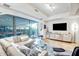 Modern living room with floor-to-ceiling windows, sleek furniture, and stylish decor at 7121 E Rancho Vista Dr # 2002, Scottsdale, AZ 85251