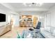 Spacious living room area featuring a breakfast bar, modern seating, and travertine flooring throughout at 7121 E Rancho Vista Dr # 2002, Scottsdale, AZ 85251