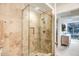 Tiled shower with glass enclosure in a modern bathroom, enhancing the home's appeal at 7121 E Rancho Vista Dr # 2002, Scottsdale, AZ 85251