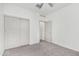 Bedroom with a ceiling fan, large closet and neutral carpet at 7234 E Eagle Nest Way, San Tan Valley, AZ 85143