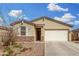 Charming single-story home with stone accents, desert landscaping and two-car garage in a great community at 7234 E Eagle Nest Way, San Tan Valley, AZ 85143