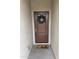 Inviting front entrance with a decorative wreath and a 'hello' doormat at 7234 E Eagle Nest Way, San Tan Valley, AZ 85143