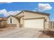 A well-maintained single-Gathering home with an attached two-car garage and neutral color scheme at 7234 E Eagle Nest Way, San Tan Valley, AZ 85143