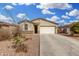 Charming single-story home with a well-manicured front yard and inviting curb appeal at 7234 E Eagle Nest Way, San Tan Valley, AZ 85143