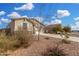 Inviting front exterior showcasing desert landscaping and a well-maintained facade at 7234 E Eagle Nest Way, San Tan Valley, AZ 85143