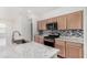 Stylish kitchen with granite countertops, stainless steel appliances, and modern backsplash at 7234 E Eagle Nest Way, San Tan Valley, AZ 85143