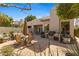 Inviting backyard features a built-in grill, spacious patio, and comfortable seating, perfect for outdoor entertaining at 7282 E Del Acero Dr, Scottsdale, AZ 85258