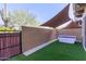 Backyard with turf, a custom shade, and a privacy wall at 7324 E Vista Bonita Dr, Scottsdale, AZ 85255