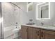 Bathroom with a marble shower, a tiled backsplash, and a vanity with wood cabinets at 7324 E Vista Bonita Dr, Scottsdale, AZ 85255