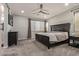 Spacious bedroom with a ceiling fan, carpet, and large windows for natural light at 7324 E Vista Bonita Dr, Scottsdale, AZ 85255