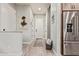 Clean entryway featuring wood-look floors and a practical basket for throws at 7324 E Vista Bonita Dr, Scottsdale, AZ 85255