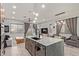 Open-concept kitchen with an island and seating, flowing into the living area at 7324 E Vista Bonita Dr, Scottsdale, AZ 85255