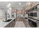 Modern kitchen equipped with a stainless steel refrigerator and oven at 7324 E Vista Bonita Dr, Scottsdale, AZ 85255