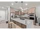 Stylish kitchen with a marble countertop island and modern stainless steel appliances at 7324 E Vista Bonita Dr, Scottsdale, AZ 85255