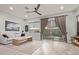 Inviting living room with wood-look tile floors, neutral walls, and a sliding glass door to the backyard at 7324 E Vista Bonita Dr, Scottsdale, AZ 85255